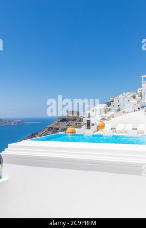Perfect travel scenery with swimming pool and sea view. Wonderful blue sky and sunlight. Amazing view infinity pool Santorini, luxury summer travel Stock Photo