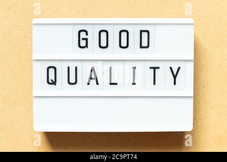 Lightbox with word good quality on wood background Stock Photo