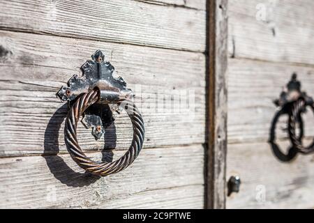 Close up shot of an old ottoman door. Unique door handles that are ancient and full of history. Stock Photo