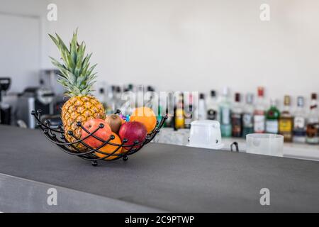 Tasty cocktails in the bar. Healthy green detox drink, pineapple cocktail and classic espresso martini in glass on the bar counter Stock Photo