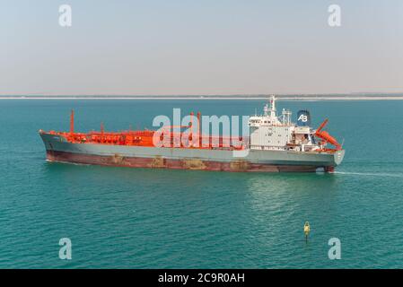 Suez, Egypt - November 14, 2019: LPG Tanker vessel Ramagas passing Suez Canal in Egypt. An LPG tanker is a gas gas tanker ship designed for transporti Stock Photo