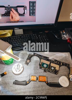 Budva, Montenegro - 01 august 2020: Apple MacBook Pro laptop motherboard and processor cooling system. Replacing thermal paste in a laptop. Home Stock Photo