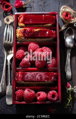 Raspberry cheesecake.Fresh fruit.Low fat dessert.Healthy food and drink.Sweet box. Stock Photo