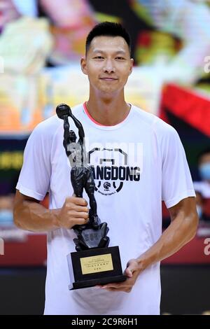 Qingdao, China's Shandong Province. 2nd Aug, 2020. The regular season's Most Valuable Player (MVP) Yi Jianlian poses with trophy before a quarter-final match between Guangdong Southern Tigers and Qingdao Eagles in at the 2019-2020 Chinese Basketball Association (CBA) league in Qingdao, east China's Shandong Province, on Aug. 2, 2020. Credit: Li Ziheng/Xinhua/Alamy Live News Stock Photo