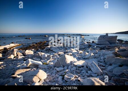 Blocks of marble in the sea on Aliki, Thassos island, Greece Stock Photo