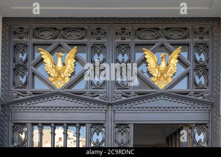 Golden bird decoration on transom above the front door Stock Photo