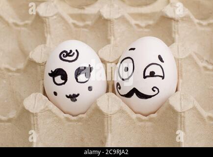 Two funny painted eggs, a lady and a gentleman Stock Photo