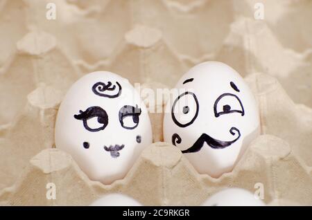 Two eggs with painted faces, a lady and a gentleman Stock Photo