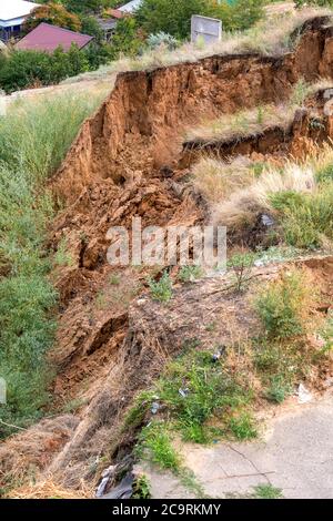 Soil landslide on slopes after degradation of the soil rain or underground water and an earthquake. Stock Photo