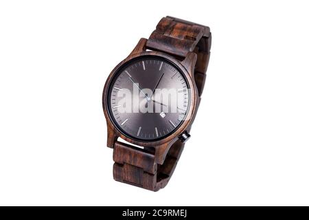 wooden eco wrist watch of dark brown color with black aluminum dial with arrows and date, isolated object on white background. Stock Photo