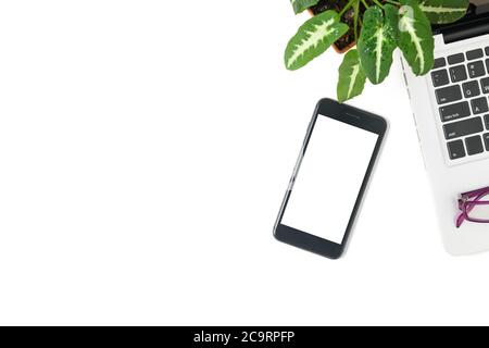 White screen mobile phone and laptop isolated on white background, top view and copy space Stock Photo
