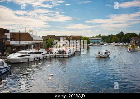 Wroxham Norfolk Broads, view of pleasure boats moored along the River Bure in the centre of Wroxham in the heart of the Norfolk Broads, England, UK Stock Photo