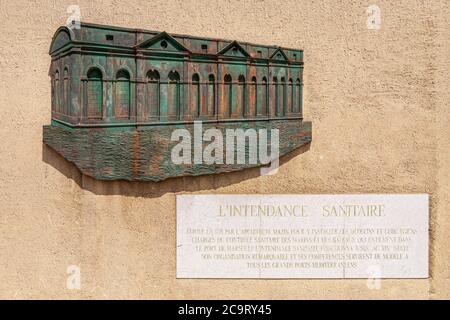 The historic sign on the L'Intendance Sanitaire du Vieux Port in Marseille, France  The building was one of the places of entry into southern France f Stock Photo