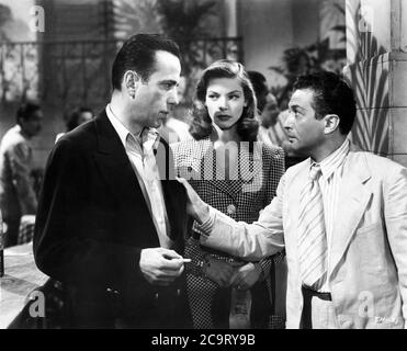 HUMPHREY BOGART LAUREN BACALL and MARCEL DALIO in TO HAVE AND HAVE NOT 1944 director HOWARD HAWKS novel ERNEST HEMINGWAY screenplay JULES FURTHMAN and WILLIAM FAULKNER Warner Bros. Stock Photo