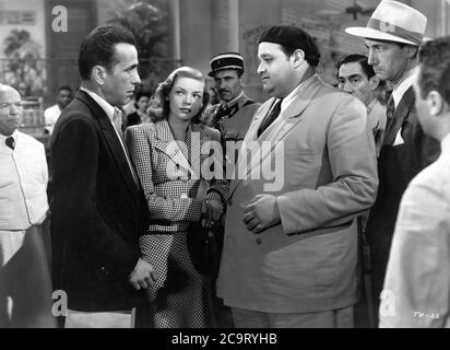 HUMPHREY BOGART LAUREN BACALL DAN SEYMOUR ALDO NALDI and MARCEL DALIO in TO HAVE AND HAVE NOT 1944 director HOWARD HAWKS novel ERNEST HEMINGWAY screenplay JULES FURTHMAN and WILLIAM FAULKNER Warner Bros. Stock Photo