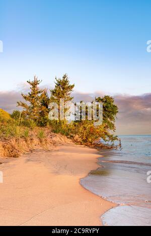 The sun rises over Lake Michigan at Sleeping Bear National Lakeshore, MI Stock Photo