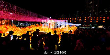Night shot of scenic Mid-Autumn Festival with fire dragon and large crowd in Hong Kong Stock Photo
