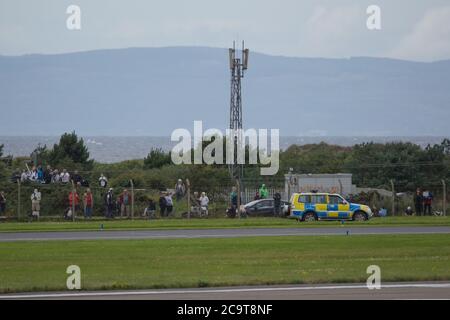 Prestwick, Scotland, UK. 2 August 2020 Pictured: Crowds of aviation enthusiasts and plane spotters turned out to see the Antonov An-225 Mryia (Reg UR-82060) make a scheduled arrival for a refeulling stop at Glasgow Prestwick Airport from Bangor, USA before departing at 4.30pm for Châteauroux-Centre Airport in France. The giant strategic airlift cargo plane behemoth is powered by six massive Six Ivchenko Progress Lotarev D-18T three shaft turbofan engines, has a maximum takeoff weight of 640 tonnes. Credit: Colin Fisher/Alamy Live News Stock Photo