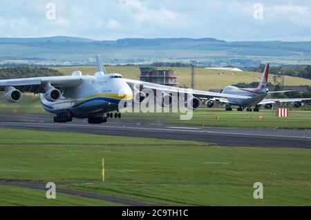 Prestwick, Scotland, UK. 2nd Aug, 2020. Pictured: Crowds of aviation enthusiasts and plane spotters turned out to see the Antonov An-225 Mryia (Reg UR-82060) make a scheduled departure after a refuelling stop at Glasgow Prestwick Airport from Bangor, USA before departing this afternoon for Châteauroux-Centre Airport in France. The giant strategic airlift cargo plane behemoth is powered by six massive Six Ivchenko Progress Lotarev D-18T three shaft turbofan engines, has a maximum takeoff weight of 640 tonnes. Credit: Colin Fisher/Alamy Live News Stock Photo