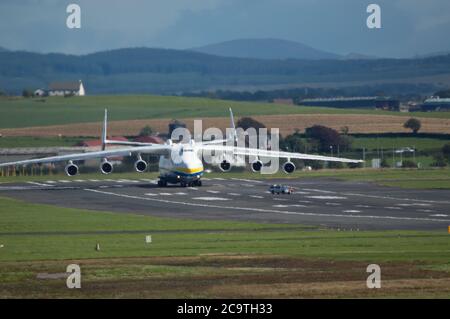 Prestwick, Scotland, UK. 2nd Aug, 2020. Pictured: Crowds of aviation enthusiasts and plane spotters turned out to see the Antonov An-225 Mryia (Reg UR-82060) make a scheduled departure after a refuelling stop at Glasgow Prestwick Airport from Bangor, USA before departing this afternoon for Châteauroux-Centre Airport in France. The giant strategic airlift cargo plane behemoth is powered by six massive Six Ivchenko Progress Lotarev D-18T three shaft turbofan engines, has a maximum takeoff weight of 640 tonnes. Credit: Colin Fisher/Alamy Live News Stock Photo