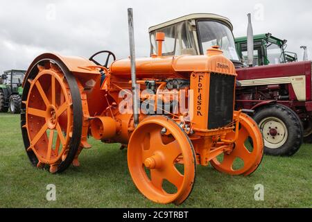 orange Fordson Tractor at a classic car show Stock Photo