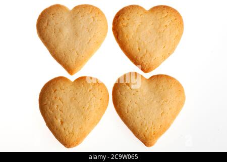 Assortment of biscuits isolated on white background. Different sorts of cookies  for Valentine's day, Christmas and other celebrations Stock Photo