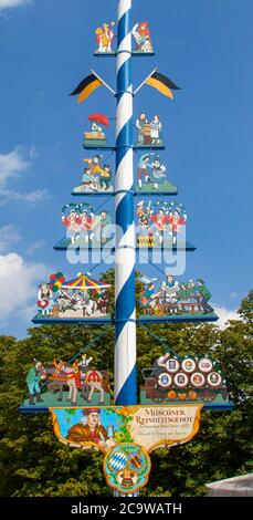 Maypole, Viktualienmarkt, Munich, Bavaria, Germany.  Figures represent the various food crafts available in this venerable, gourmet, open-air market. Stock Photo
