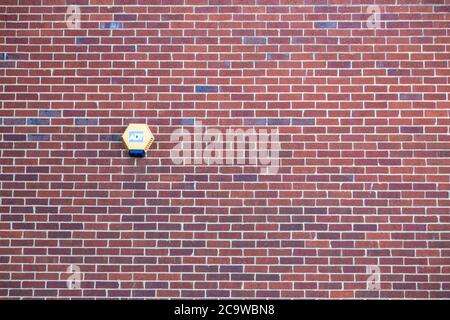 An ADT security alarm on the side of a Brick house Stock Photo