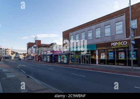 London Road shops in North End Portsmouth, a typical English high street with no shoppers Stock Photo