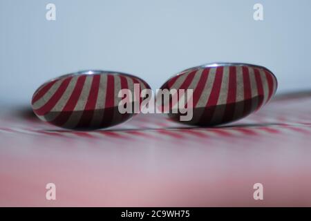 Two spoons composed to reflect red vertical lines Stock Photo