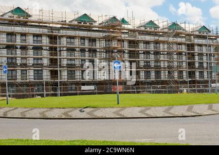 Scaffolding surrounding house development for safe access to construction work Stock Photo