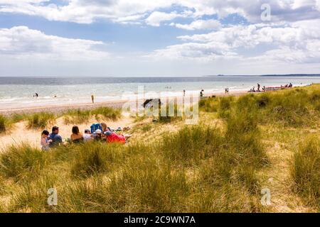 People on the beach, in the dunes at Walberswick, Suffolk, UK. Stock Photo