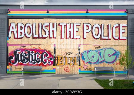 A boarded up business near the 3rd Police Precent Station on East Lake Street during the civil unrest in Minneapolis, Minnesota Stock Photo