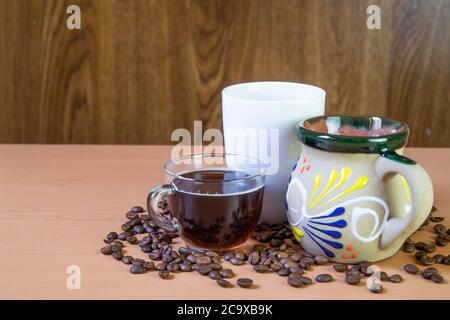 coffee cups with coffee beans on the table. with Copy space Stock Photo