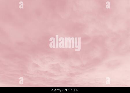 Beautiful sky with cirrocumulus clouds, pink coral watercolor toned Stock Photo