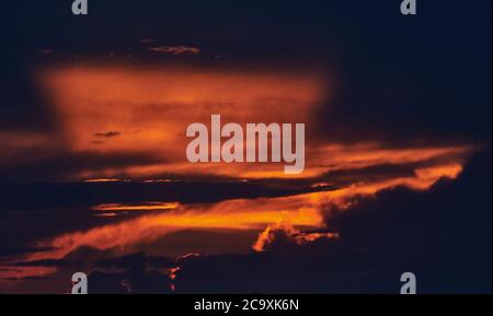 A sign in front of a sunset Stock Photo