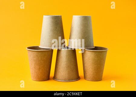 The concept of eco fast food. Cardboard cups of eco-friendly material on a color background close-up with a copy space. Stock Photo