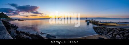 Wide panorama of Frankston foreshore and boat jetty at sunset in Melbourne, Australia Stock Photo