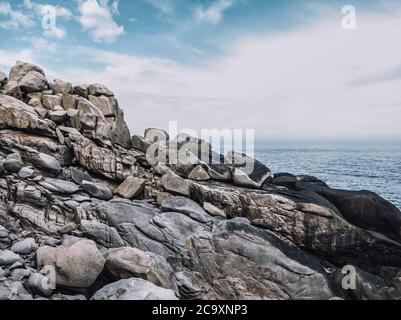 Huge strange stone and sea. Alien planet landscape, rock formations ...