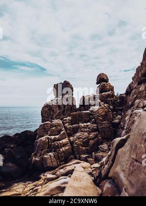 Huge strange stone and sea. Alien planet landscape, rock formations ...