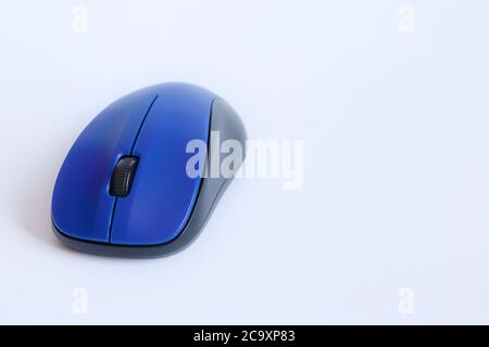 View of a blue wireless mouse on white background,  with copy space Stock Photo