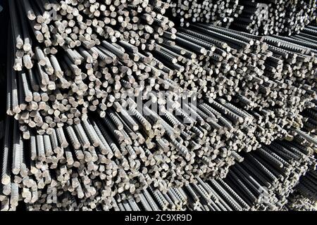 Row of steel rods in the manufacturing industry Stock Photo