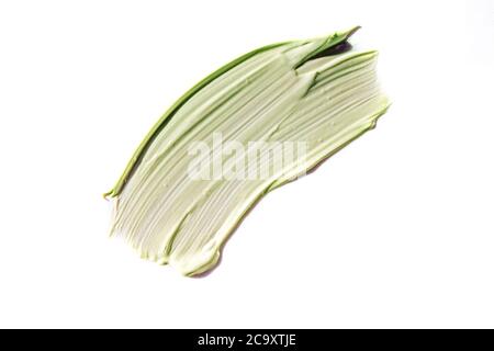 Green cosmetic clay smear isolated on white Stock Photo