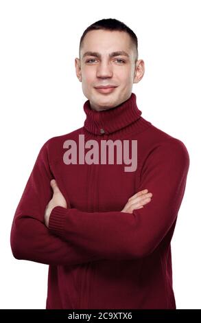 Portrait of young handsome smiling man looking at camera over white background. Stock Photo