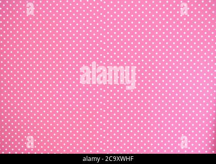 Pink background texture with white polka dots, Pink and white spot pattern can be used for background retro modern design Stock Photo