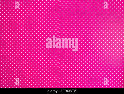 Pink background texture with white polka dots, Pink and white spot pattern can be used for background retro modern design Stock Photo