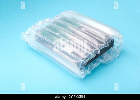 protective packaging made of polymers used for sending goods by mail. The concept of the integrity and safety of goods from shocks and damage during t Stock Photo