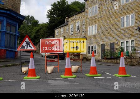 Road signs indicating a closed road in New Mills, Derbyshire. Stock Photo