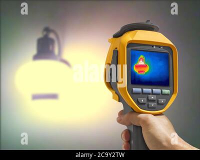Recording whit Thermal camera, Lighted classic lamp on the wall Stock Photo