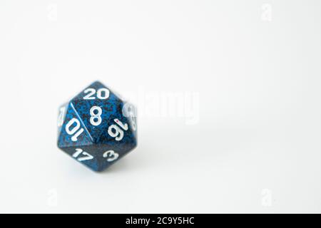 A nat 20 is rolled on a 20 sided dice used for agmes of Dungeons & Dragons, a popular tabletop roleplaying game. Stock Photo